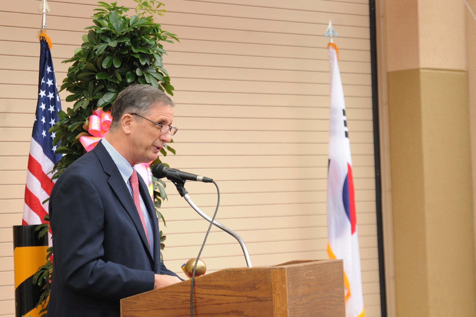 Samuel Atkins, Far East District United States Army Corps of Engineers, speaks during the ribbon cutting ceremony for the opening of a new maintenance complex at Kunsan Air Base, Republic of Korea, Nov. 9. A ribbon cutting ceremony is a traditional ceremony in many cultures that celebrates the final day of construction for a building or other projects. (U.S. Air Force photo by Senior Airman Brittany Y. Auld/Released)