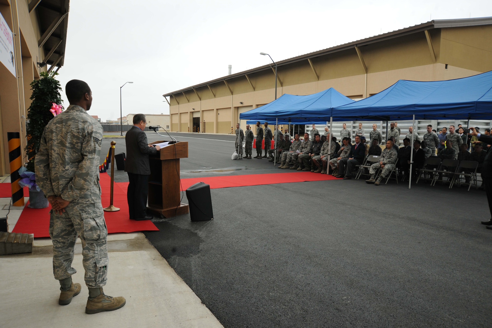 Imjoo Kim, Poong Chang Construction Company vice president, speaks during the ribbon cutting ceremony for the opening of a new maintenance complex at Kunsan Air Base, Republic of Korea, Nov. 9. The ceremony signifies the end of construction for the new Maintenance Complex Phases 1 and 3. (U.S. Air Force photo by Senior Airman Brittany Y. Auld/Released)