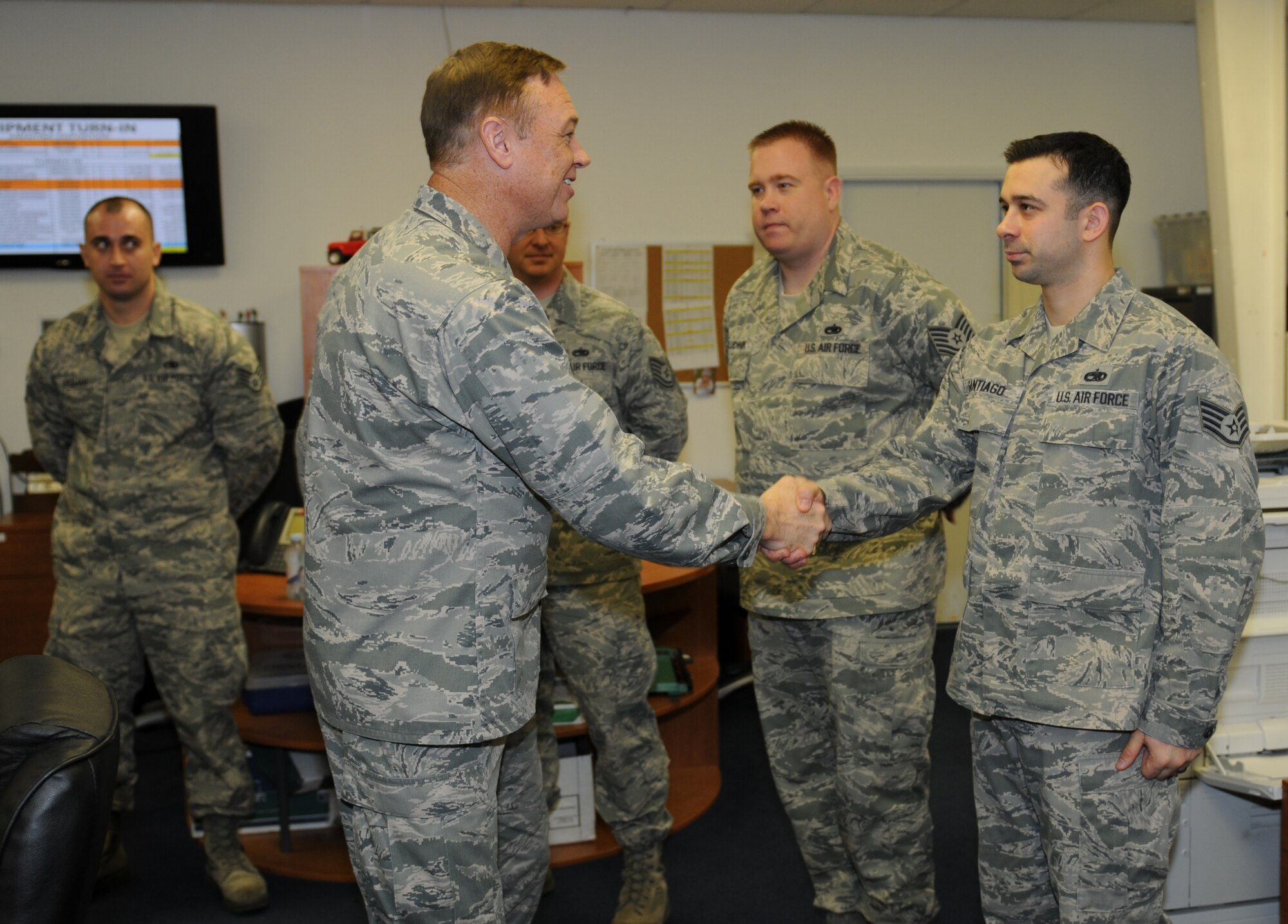 ROYAL AIR FORCE LAKENHEATH, England - Brig. Gen. Darryl W. Burke, 82nd Training Wing commander, greets Staff Sgt. Nathan Santiago, 372nd Squadron Training Detachment 16 aerospace ground equipment instructor, during a visit, Nov. 10, 2011. The general toured the 372nd TRS Detachment 16 and was briefed by flight control, canopy, avionics and engine instructors.  (U.S. Air Force photo by Airman 1st Class Cory D. Payne)
