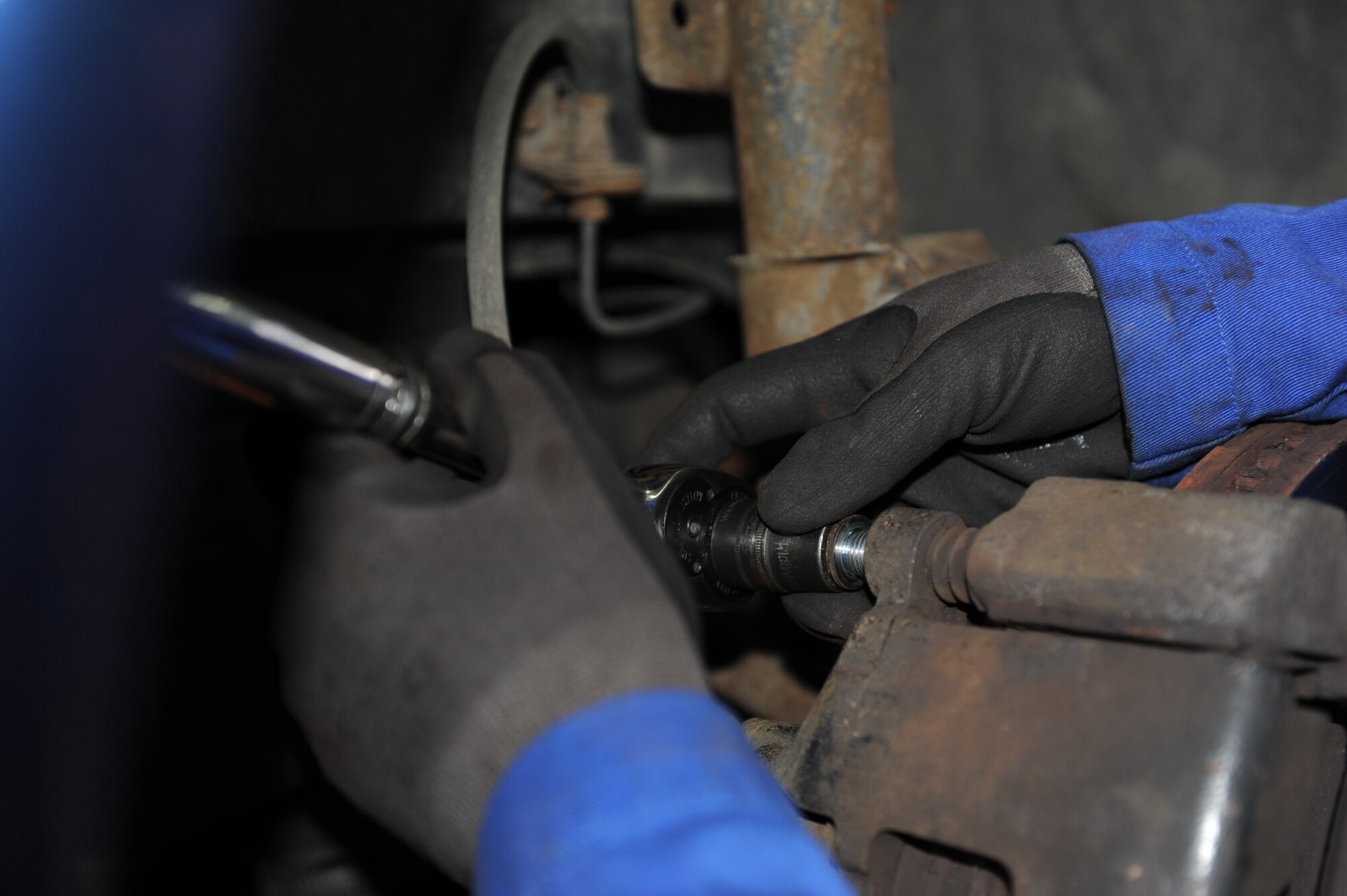 SPANGDAHLEM AIR BASE, Germany – Senior Airman Jeremy Yeater, 52nd Logistics Readiness Squadron vehicle equipment maintainer, takes bolts off a caliper mount of a government vehicle during an inspection of an anti-lock breaking system here Nov. 9. The 52nd LRS Vehicle Maintenance Flight is responsible for servicing all of the government vehicles on base to ensure Spangdahlem is mission ready. (U.S. Air Force photo/Senior Airman Christopher Toon)