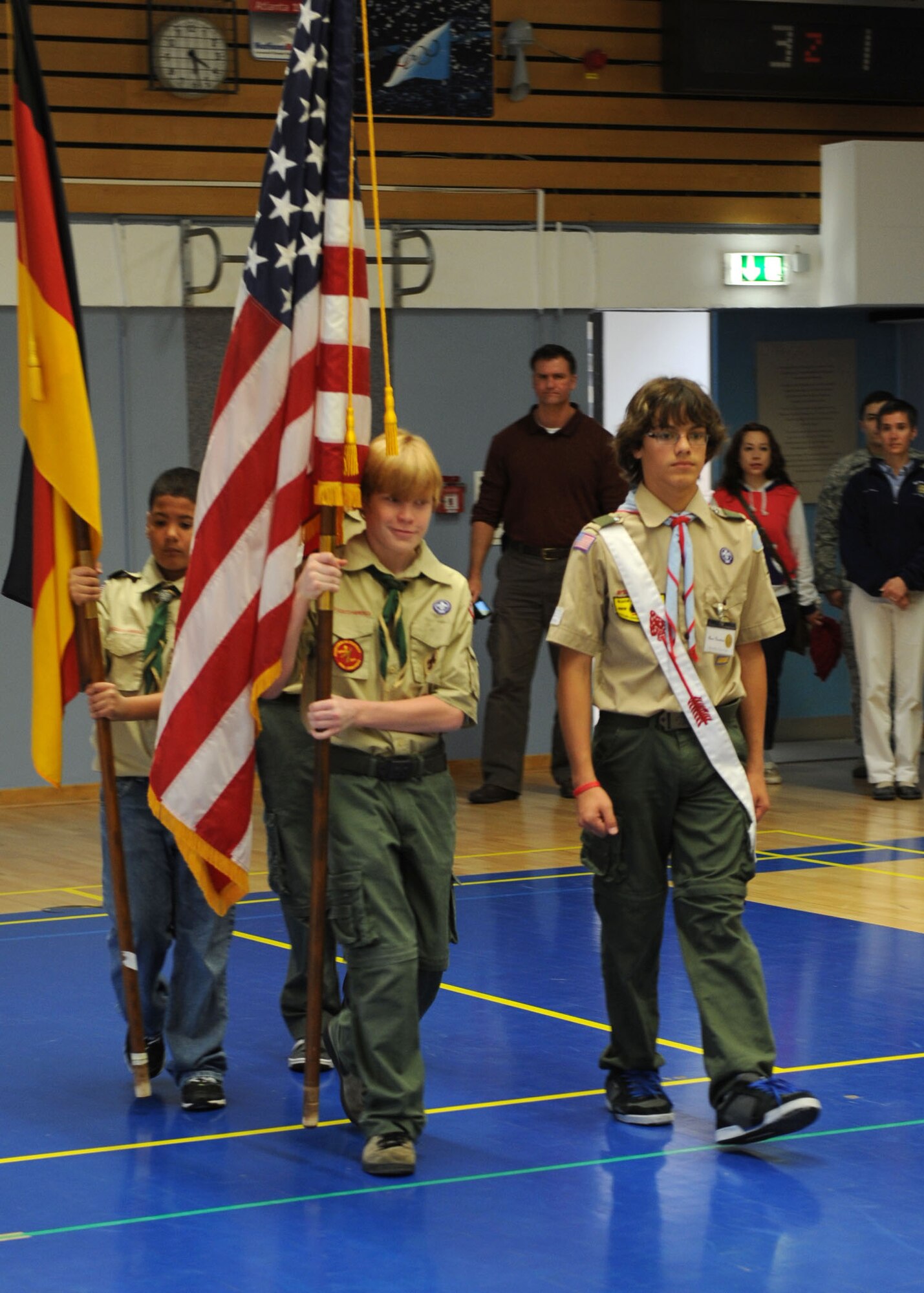BITBURG ANNEX, Germany – Members of the Bitburg Middle School Boy Scouts troop 161 carry the American and German flags during the posting of colors at a Veterans Day ceremony at Bitburg Middle School Nov. 9. Veterans Day is an annual U.S. holiday honoring military veterans who have served in the military past and present. (U.S. Air Force photo/Senior Airman Christopher Toon)