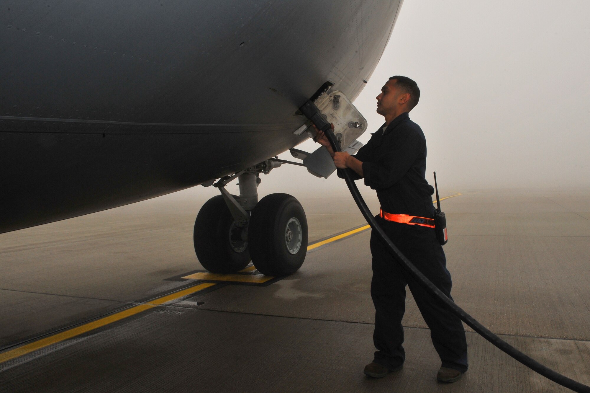 SPANGDAHLEM AIR BASE, Germany – Staff Sgt. Mark Lipumano, 726th Air Mobility Squadron electrical environmental craftsman, attaches a power cable to a C-17 Globemaster III during a pre-flight inspection here Nov. 9. The 726th AMS is a strategic transit hub in Europe and provides support for heavy cargo aircraft and aircrews throughout the world. (U.S. Air Force photo/Airman 1st Class Dillon Davis)