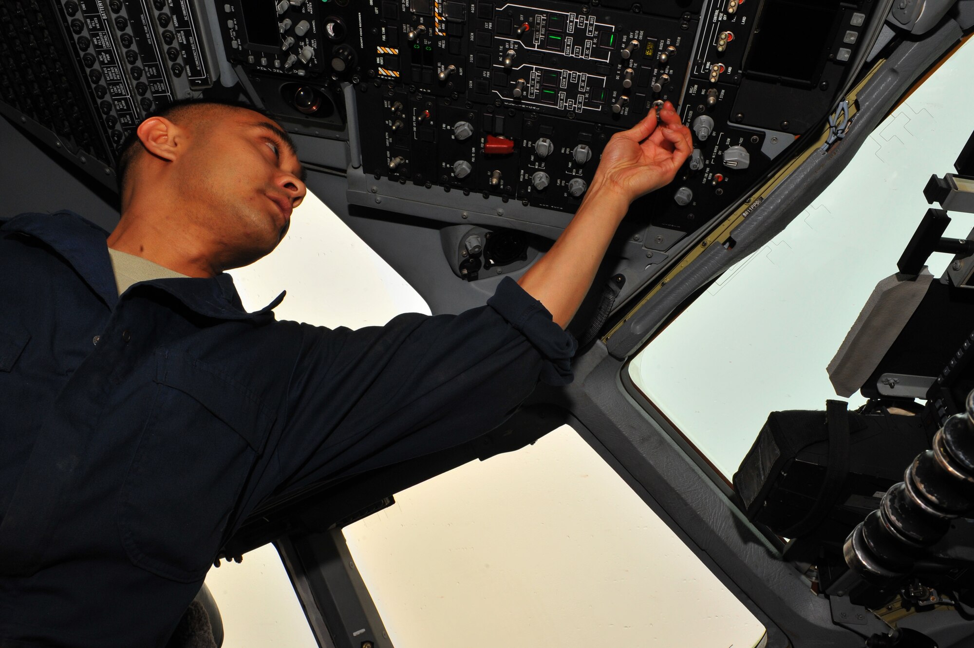 SPANGDAHLEM AIR BASE, Germany – Staff Sgt. Mark Lipumano, 726th Air Mobility Squadron electrical environmental craftsman, turns battery power on inside the cabin of a C-17 Globemaster III during a pre-flight inspection here Nov. 9. The 726th AMS is a strategic transit hub in Europe and provides support for heavy cargo aircraft and aircrews throughout the world. (U.S. Air Force photo/Airman 1st Class Dillon Davis)