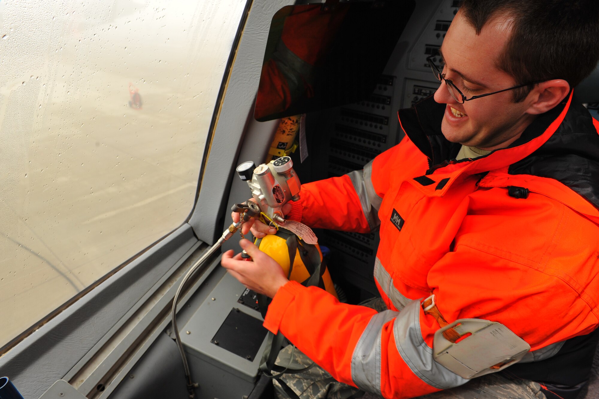 SPANGDAHLEM AIR BASE, Germany – Staff Sgt. Randle Johnson, 726th Air Mobility Squadron communication and navigation craftsman, ensures that emergency oxygen tanks are properly filled in between flights of a C-17 Globemaster III here Nov. 9. The 726th AMS is a strategic transit hub in Europe and provides support for heavy cargo aircraft and aircrews throughout the world. (U.S. Air Force photo/Airman 1st Class Dillon Davis)