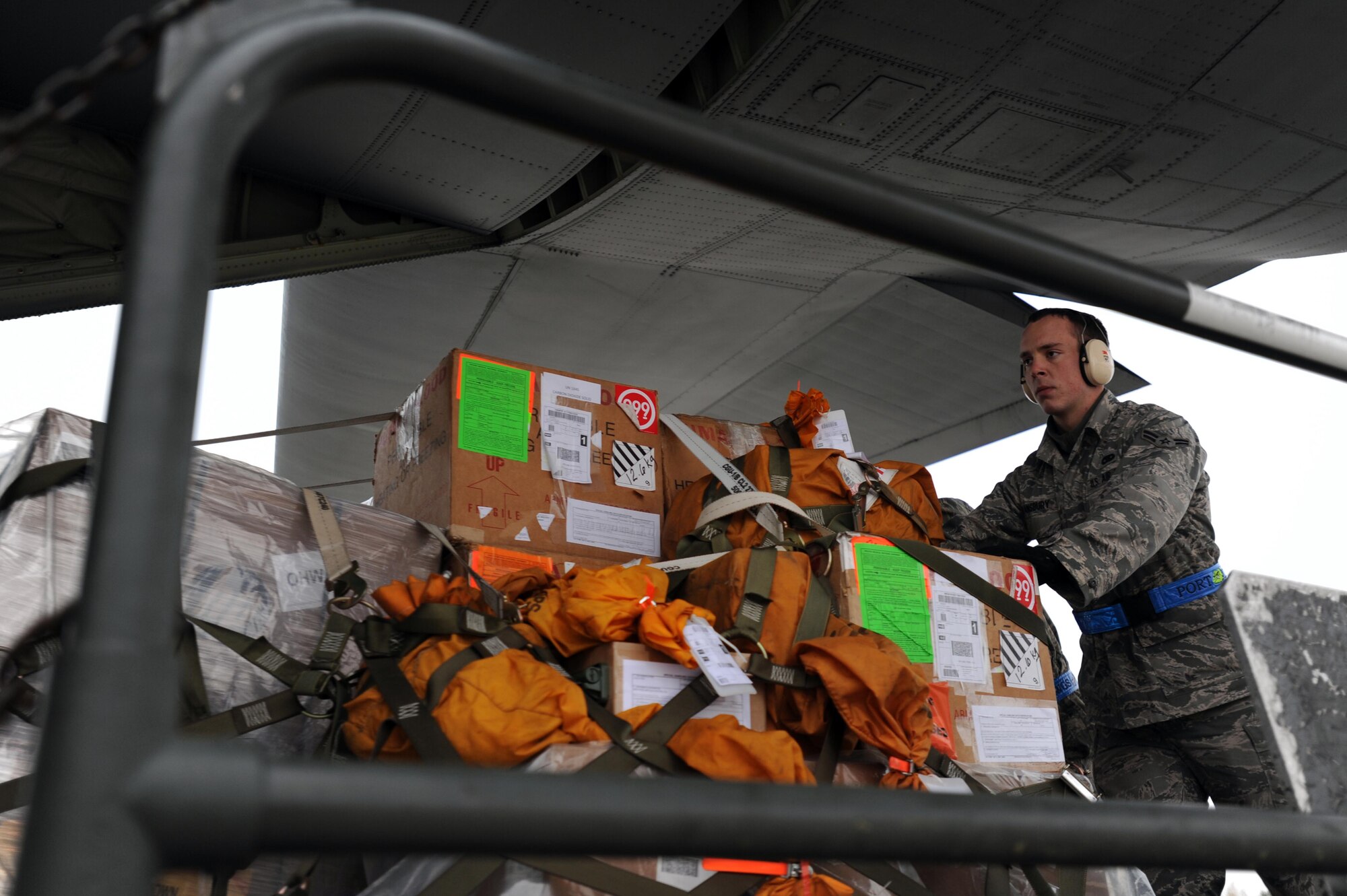Air Force Airman 1st Class Chris Gransbury, 721 Aerial Port Squadron, loads a pallet of humanitarian supplies for transportation, Ramstein Air Base, Nov. 13, 2011. The effort is in support of the Turkey-led relief efforts following the Oct. 23, 2011, earthquake in Van province, Turkey. At the request of the Turkish government the Department of Defense has tasked U.S. European Command to airlift relief supplies to Van province. (U.S. Air Force Photo by Airman 1st Class Caitlin O?Neil-McKeown)