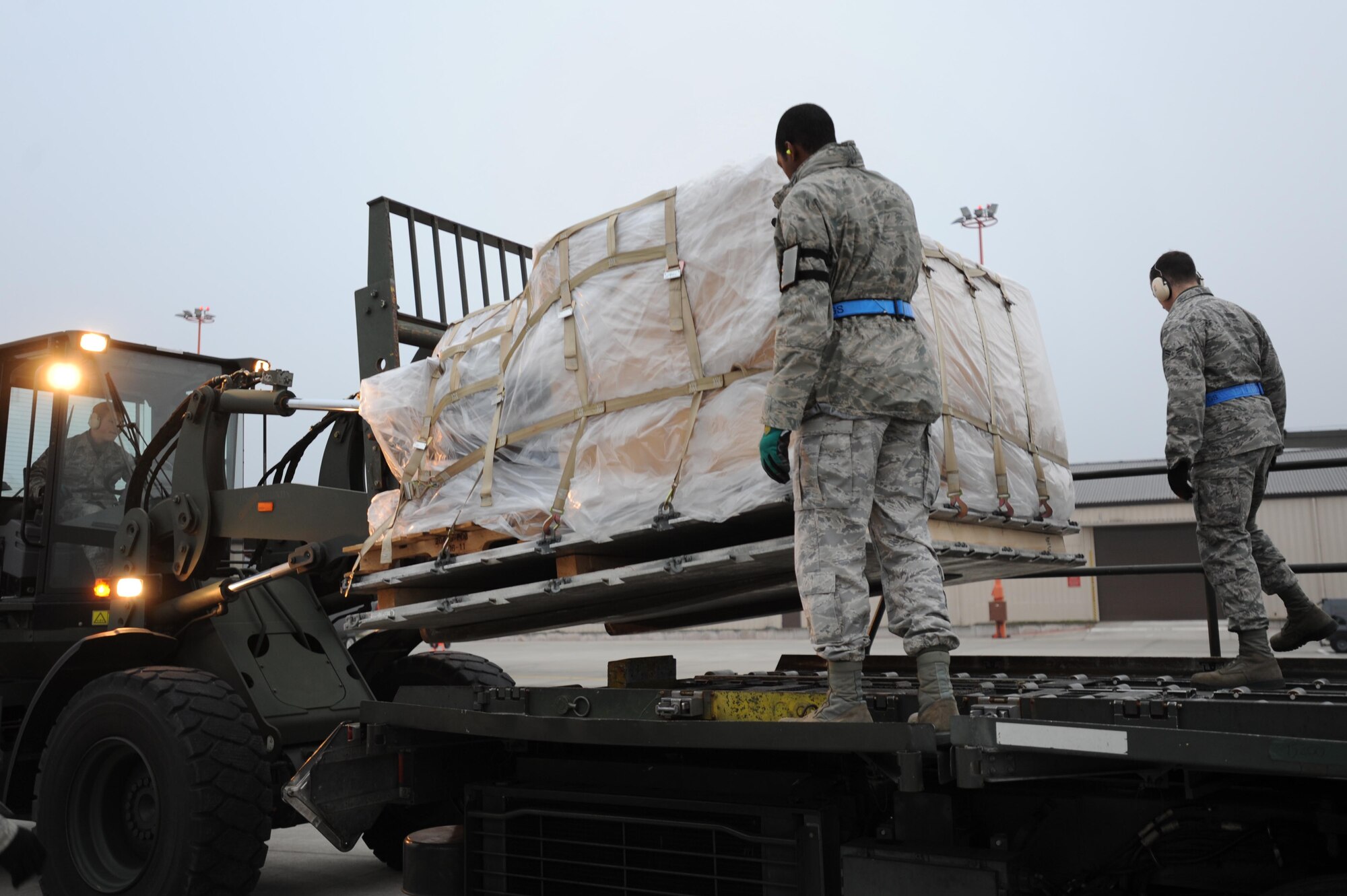 Members of the 86th Aircraft Maintenance Squadron load pallets of humanitarian supplies for transportation, Ramstein Air Base, Nov. 13, 2011. The effort is in support of the Turkey-led relief efforts following the Oct. 23, 2011, earthquake in Van province, Turkey. At the request of the Turkish government the Department of Defense has tasked U.S. European Command to airlift relief supplies to Van province. (U.S. Air Force Photo by Airman 1st Class Caitlin O?Neil-McKeown) 