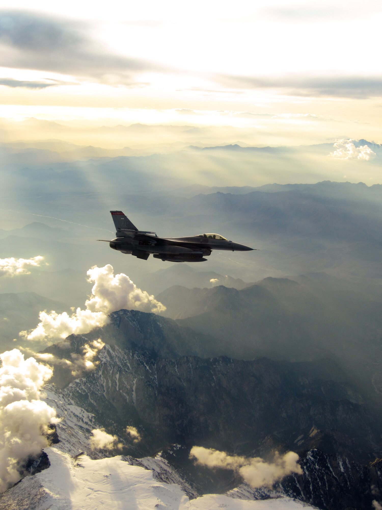 An F-16 Fighting Falcon flies over rugged landscape during a mission Nov. 11, 2011. F-16s from the 121st Expeditionary Fighter Squadron and F-15s from the 335th EFS dropped more than 9,000 lbs of munitions through severe weather on enemy forces trying to overrun a combat outpost in Paktika province, Afghanistan, Nov. 8, 2011. Their efforts helped kill 70 insurgents and resulted in zero coalition casualties. U.S. Air Force photo/Capt. Brandon Cyr)