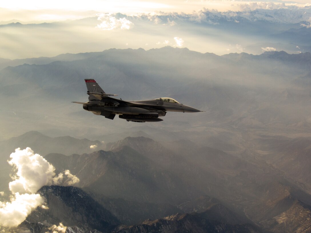 An F-16 Fighting Falcon flies over rugged landscape during a mission Nov. 11, 2011. F-16s from the 121st Expeditionary Fighter Squadron and F-15s from the 335th EFS dropped more than 9,000 lbs of munitions through severe weather on enemy forces trying to overrun a combat outpost in Paktika province, Afghanistan, Nov. 8, 2011. Their efforts helped kill 70 insurgents and resulted in zero coalition casualties. (U.S. Air Force photo/Capt. Brandon Cyr)