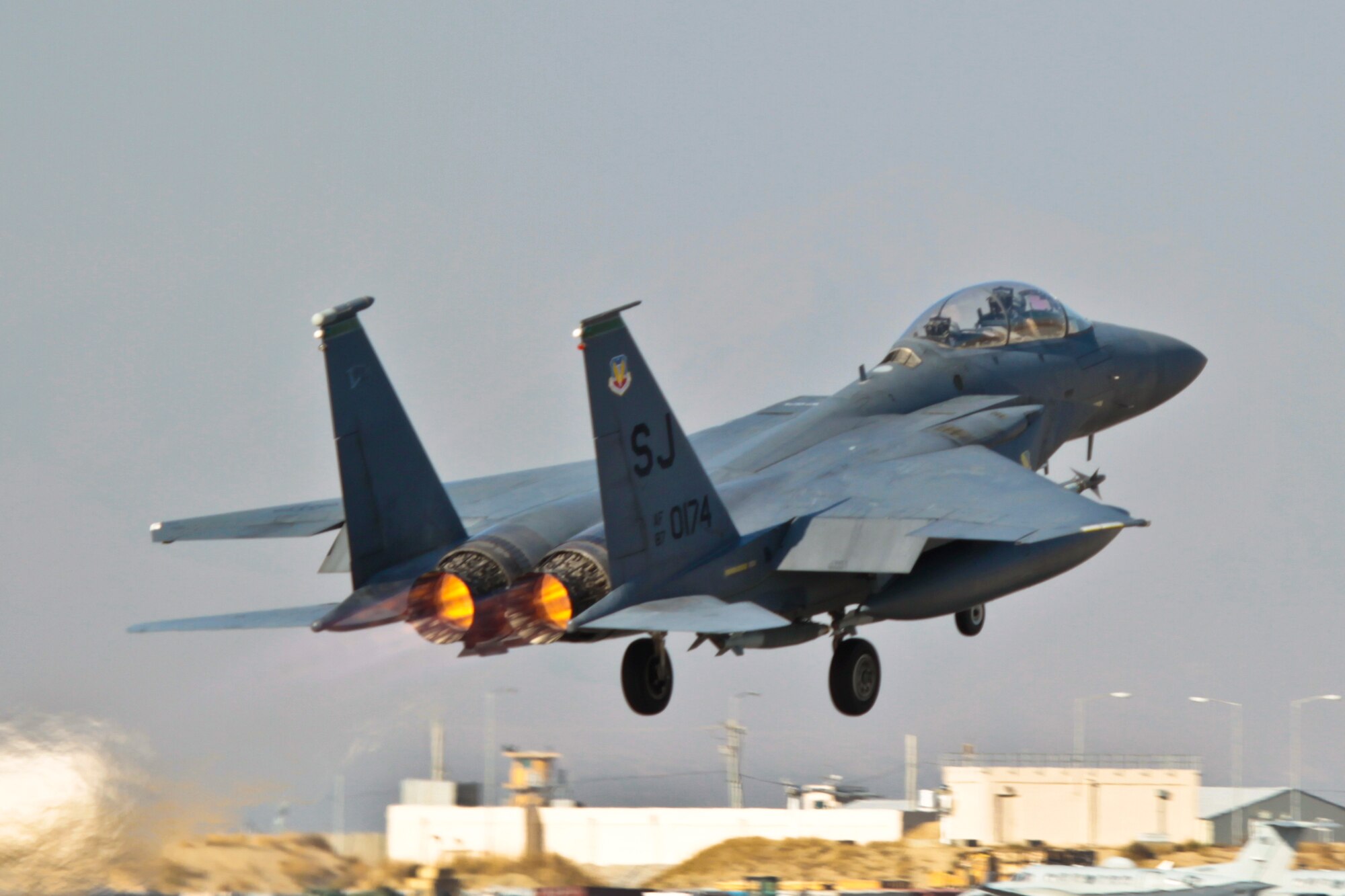 An F-15E Strike Eagle takes from Bagram Airfield Nov. 11, 2011. F-15s from the 335th Expeditionary Fighter Squadron and F-16 Fighting Falcons from the 121st EFS dropped more than 9,000 lbs of munitions through severe weather on enemy forces trying to overrun a combat outpost in Paktika province, Afghanistan, Nov. 8, 2011. Their efforts helped kill 70 insurgents and resulted in zero coalition casualties. (U.S. Air Force photo/Tech Sgt. Matthew Hecht)