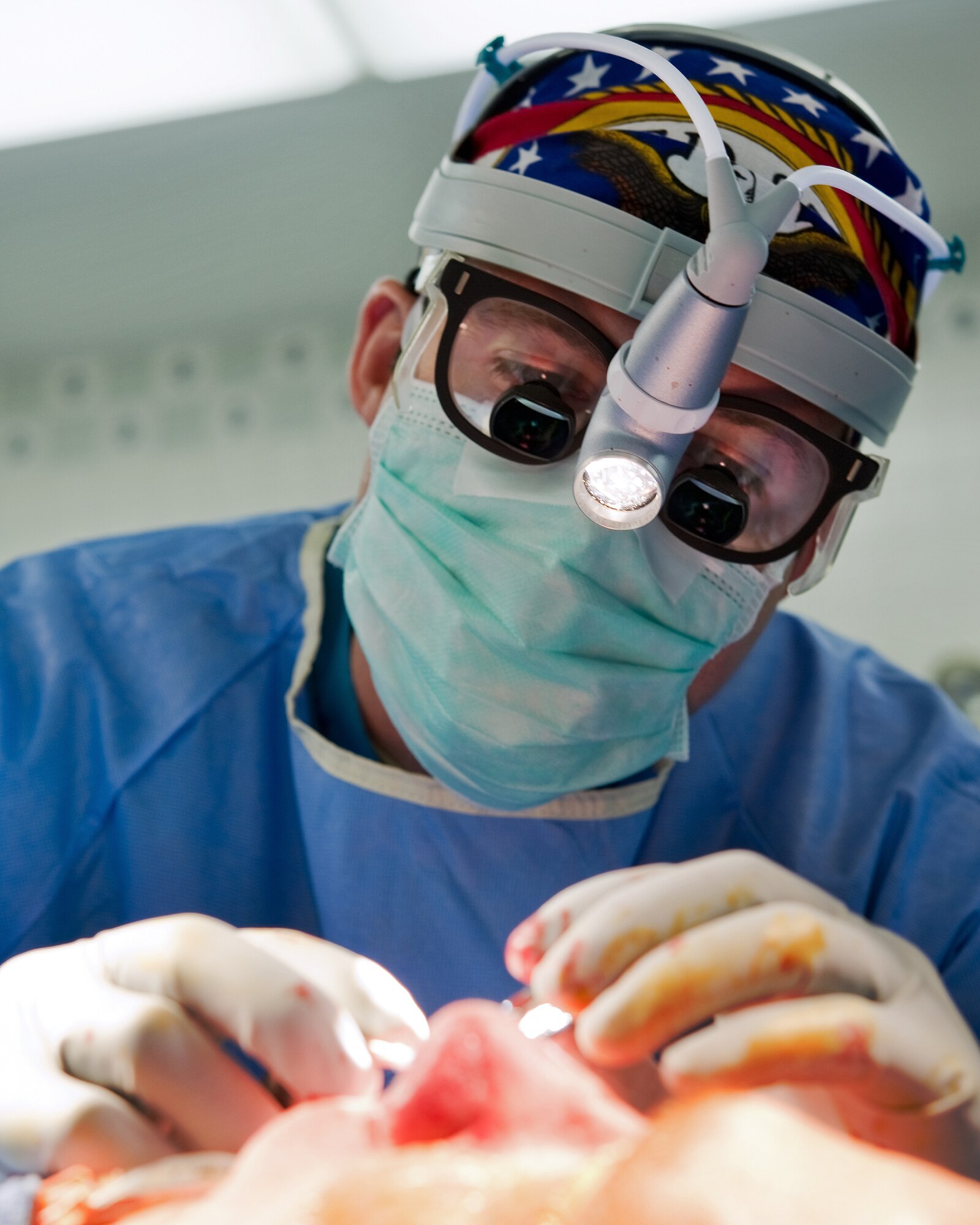 YOKOTA AIR BASE, Japan -- Capt. Leland Webb, 374th Surgical Operations Squadron general surgeon, secures cartilage grafts during a septorhinoplasty, a procedure performed to reconstruct a nasal passage and improve a patients breathing by reconstructing the cartilaginous and bony structure of the nose, at Yokota's base hospital, Nov. 9, 2011. The 374th MSGS performs 15 to 20 procedures per month. (U.S. Air Force photo/Osakabe Yasuo)