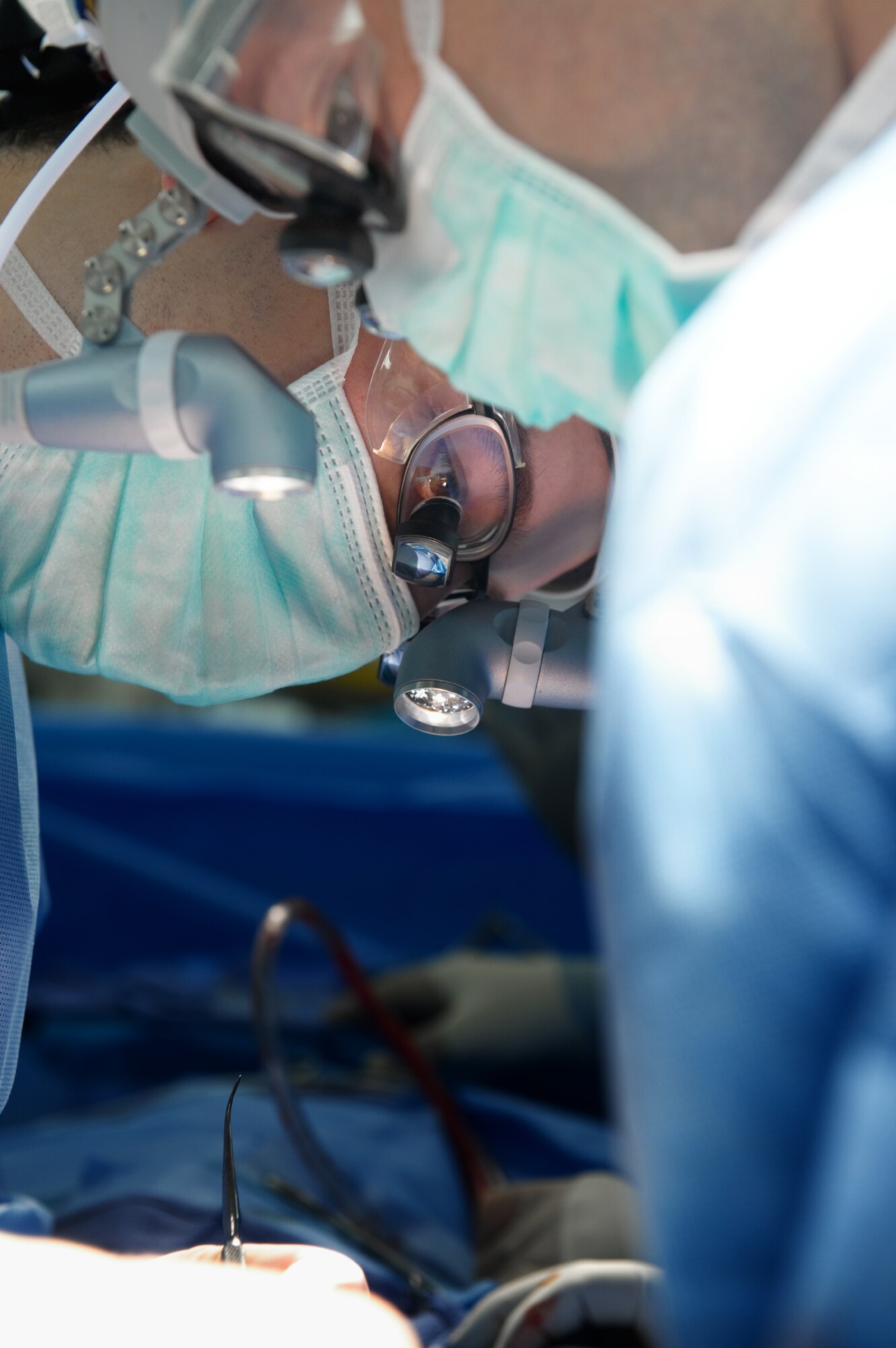 YOKOTA AIR BASE, Japan -- Capt. Leland Webb (front), General Surgeon, and Capt. Scott McCusker (back), Chief Otolaryngologist, both from the 374th Surgical Operations Squadron, perform a septorhinoplasty, a procedure performed to reconstruct a nasal passage and improve a patients breathing by reconstructing the cartilaginous and bony structure of the nose, at Yokota's base hospital, Nov. 9, 2011. The 374th MSGS performs 15 to 20 procedures per month. (U.S. Air Force photo/Osakabe Yasuo)