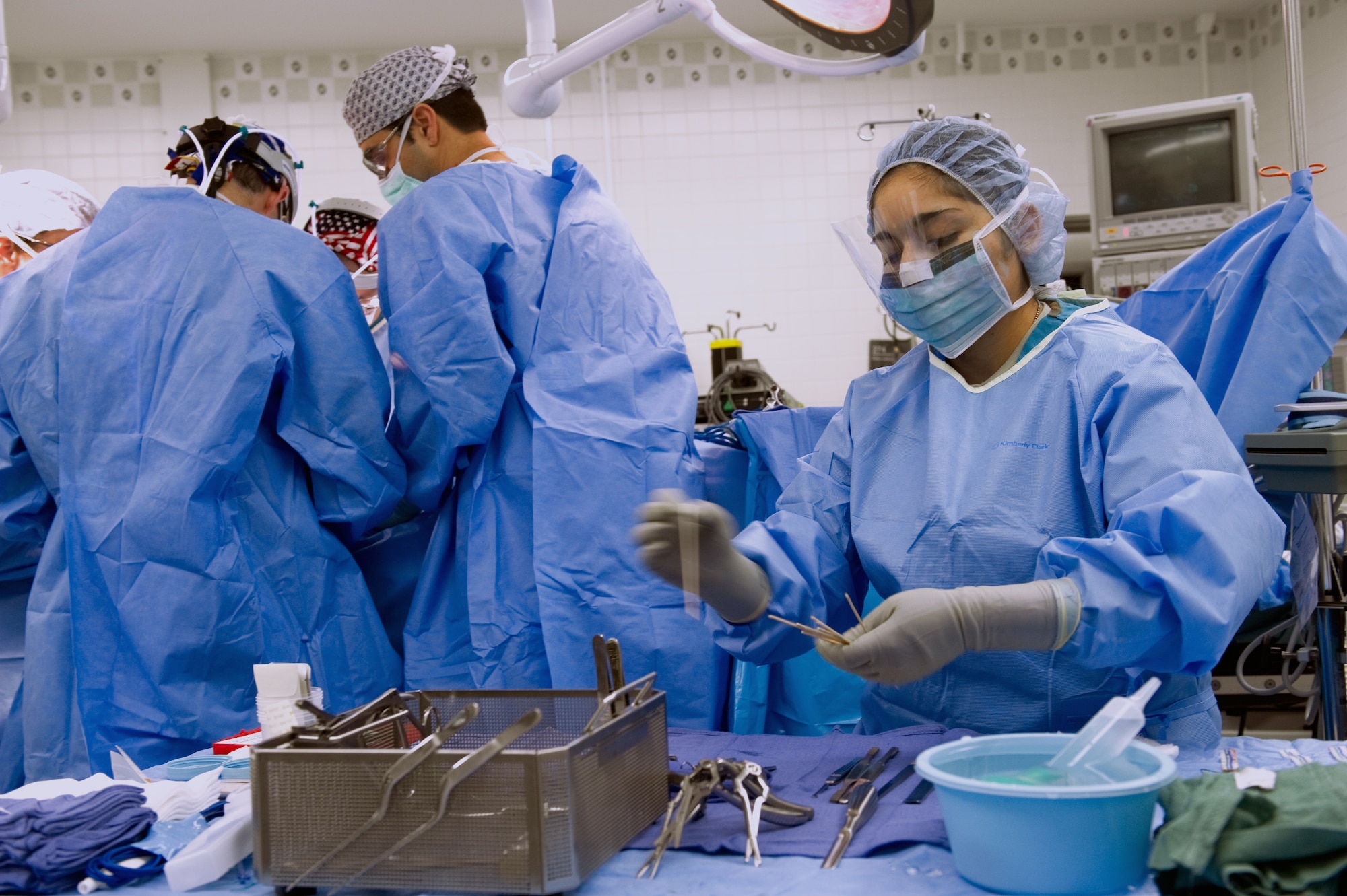 YOKOTA AIR BASE, Japan -- Staff Sgt. Elsa Spencer (right), 374th Surgical Operations Squadron ear nose and throat surgical technician, maintains surgical instruments at Yokota's base hospital, Nov. 9, 2011 during a septrhinoplasty. The 374th MSGS performs 15 to 20 procedures per month. (U.S. Air Force photo/Osakabe Yasuo)