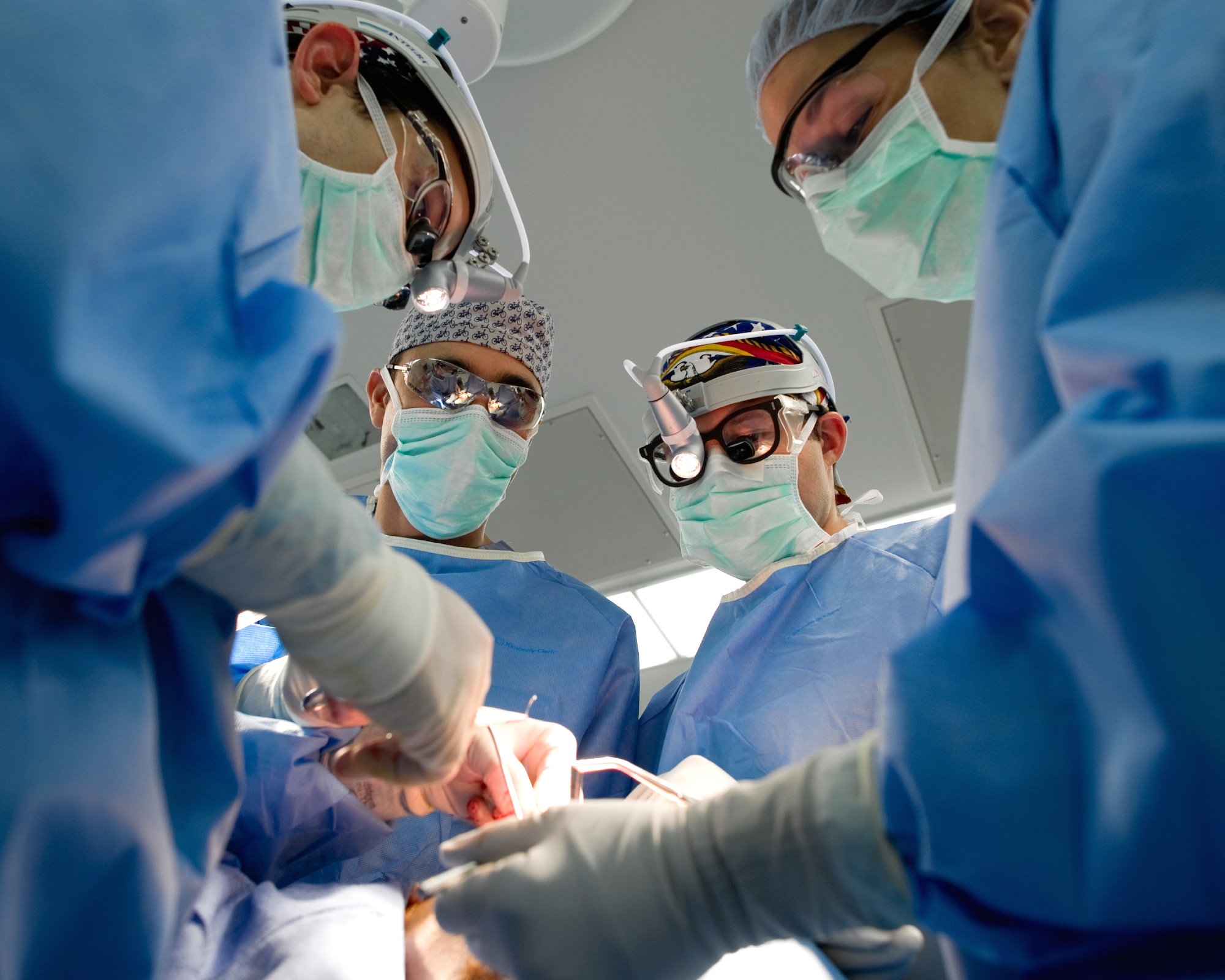 YOKOTA AIR BASE, Japan -- Members from the 374th Surgical Operations Squadron perform a septorhinoplasty, a procedure performed to reconstruct a nasal passage and improve a patients breathing by reconstructing the cartilaginous and bony structure of the nose, at Yokota's base hospital, Nov. 9, 2011. The 374th MSGS performs 15 to 20 procedures per month. (U.S. Air Force photo/Osakabe Yasuo)