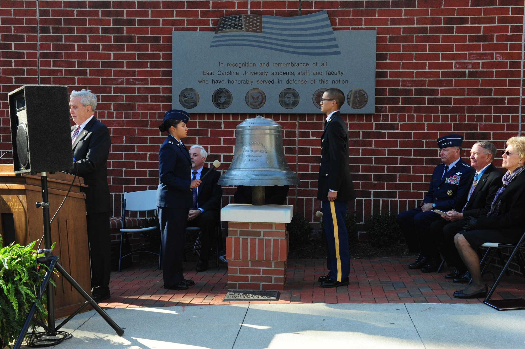 Air Force and Army Reserve Officer Training Corps cadets ring the bell at East Carolina University's Freedom Wall while Dr. Steven Duncan, ECU Director of Military Programs reads the names of veterans during a ceremony in Greenville, N.C., Nov. 11, 2011.  The Veteran's Day Address was given by Medal of Honor recipient retired Col. Joe Marm, who earned the nation's highest honor for actions taken during the Battle of Ia Drang during the Vietnam War.  (U.S. Air Force photo/Capt. Matt Schroff)