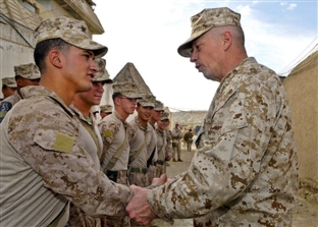 U.S. Marine Corps Gen. John R. Allen, commander of U.S. and international forces in Afghanistan, takes time to acknowledge individual Marines for their hard work and dedication during a battlefield circulation in Helmand province, Afghanistan, Nov. 7, 2011. Allen also met with Regional Command Southwest leaders for a working lunch and to receive operational updates.