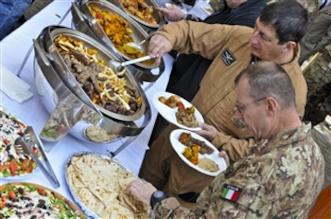Polish service members celebrate the 93rd Polish Independence Day at International Security Assistance Force headquarters in Kabul, Afghanistan, Nov. 11, 2011. U.S. Marine Corps Gen. John R. Allen, commander of U.S. and international forces, attended the celebration. Following the ceremony, attendees enjoyed a traditional Afghan lunch.