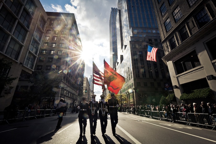 A color guard from 6th Communications Battalion, Marine Forces Reserve, led a marching detail of 200 Marines in the annual New York Veteran's Day parade, here, Nov. 11. This year marks the 92st Anniversary of The New York City Veterans Day parade. The parade is hosted by the United War Veterans Council, Inc. on behalf of the City of New York. It is the oldest and largest of its kind in the nation. Since Nov. 11, 1919, the parade has provided an opportunity for Americans and international visitors to honor those who have served, preserving our freedoms and defending our democracy. Sgt. Dakota Meyer, the recently awarded Marine Medal of Honor recipient, rode in the parade. Maj. Gen. Melvin Spiese, deputy commanding general, I Marine Expeditionary Force, represented the Marine Corps as one of the reviewing officials of the parade.