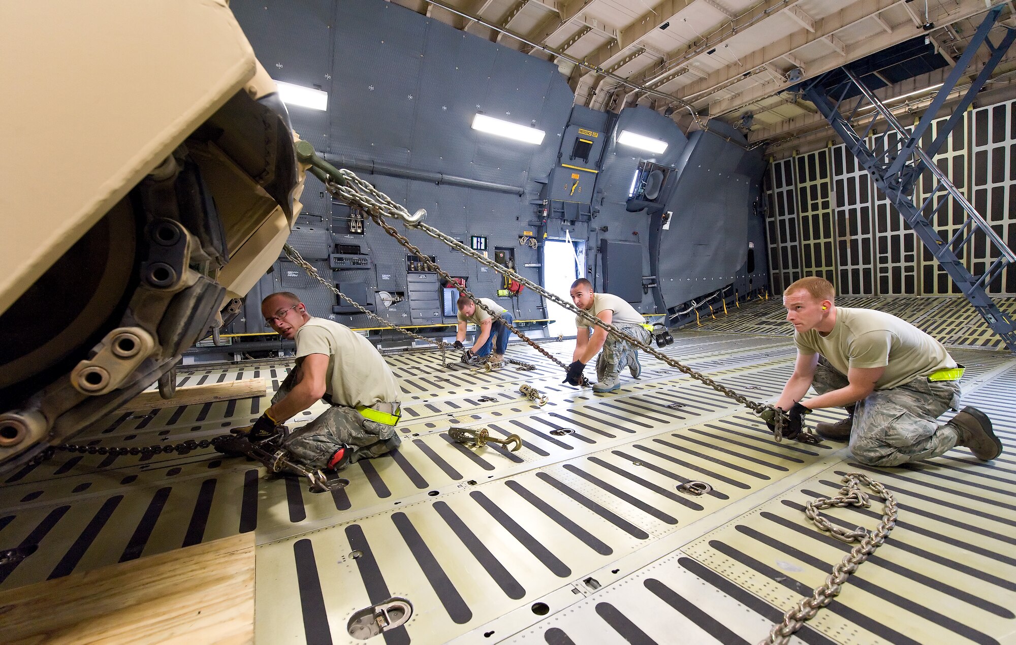 Loadmasters secure an M1 Abrams tank inside a C-5M Super Galaxy Nov. 15, 2011, at Dover Air Force Base, Del. (U.S. Air Force photo by Roland Balik)