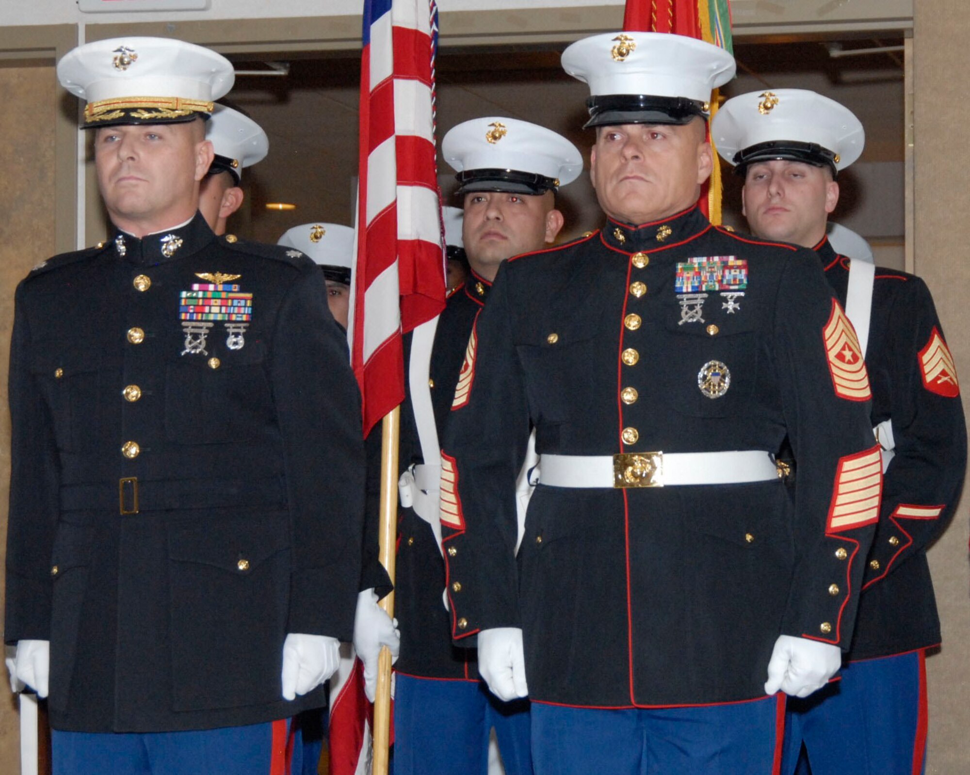 Lt. Col. Darrell Platz, commanding officer, Marine Air Group 41, Detachment Alpha and Sgt. Maj. Charles Dillree, Sergeant Major of MAG 41, Det. Alpha stand with the color guard moments before the cake cutting ceremony began at Club Muroc on Nov. 10, in honor the 236th birthday of the United States Marine Corps. (U.S. Air Force Photo by Laura Mowry)

