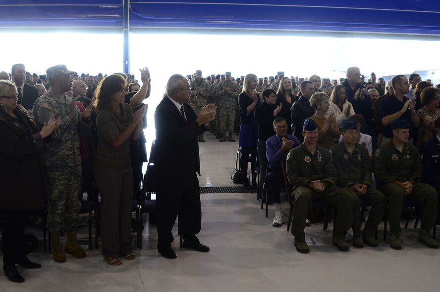 California Air National Guardsmen assigned to the 129th Rescue Wing are given a standing ovation after receiving the Distinguished Flying Cross with Valor for rescue missions in support of Operation Enduring Freedom inside Hangar 4, at Moffett Federal Airfield, Calif., Nov. 5, 2011.  (Air National Guard photo by A1C John Pharr)