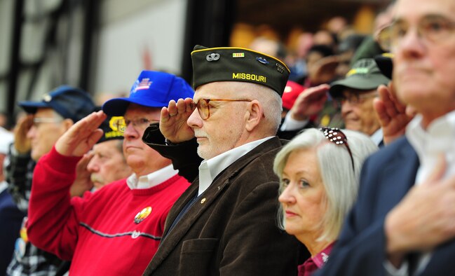 WARRENSBURG, Mo.  -- Vietnam Veterans salute the American flag during the Star Spangled Banner at a Veterans Day ceremony at the University of Central Missouri’s multi-purpose center Nov. 11. Veterans Day, formerly known as Armistice Day, is an annual U.S. holiday honoring military Veterans. Its date marks the anniversary of the German signing of the Armistice at the 11th hour of the 11th day in 1918, ending major hostilities of World War I. More than 70 Vietnam War veterans participated in the ceremony at UCM. (U.S. Air Force photo/Senior Airman Nick Wilson)