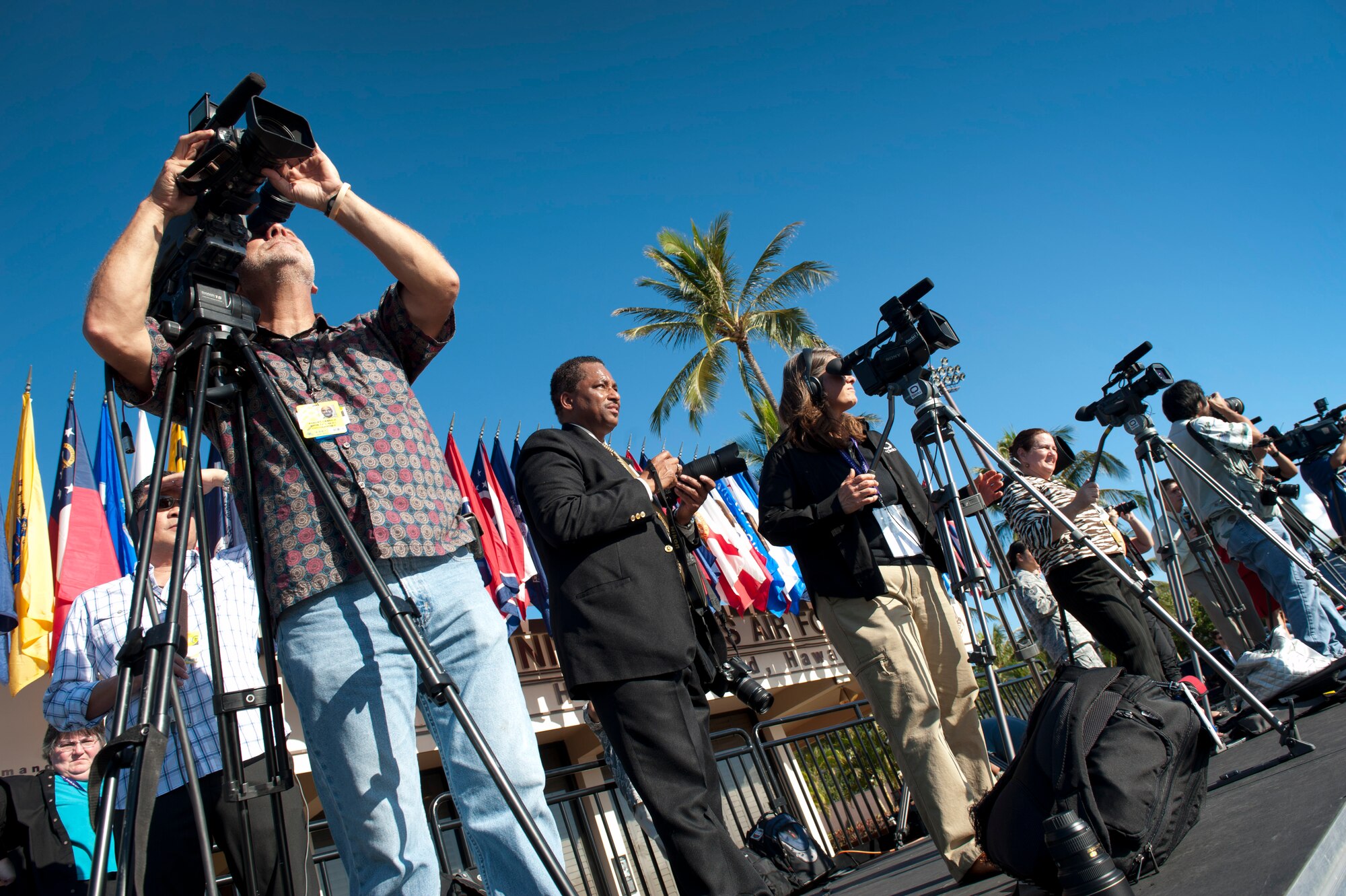 Local media broadcast the live footage of President Barack Obama's departure from Joint Base Pearl Harbor-Hickam, Hawaii, Nov. 15. President Barack Obama was in Honolulu for the Asia Pacific Economic Corporation conferences. (U.S. Air Force photo/Senior Airman Lauren Main)