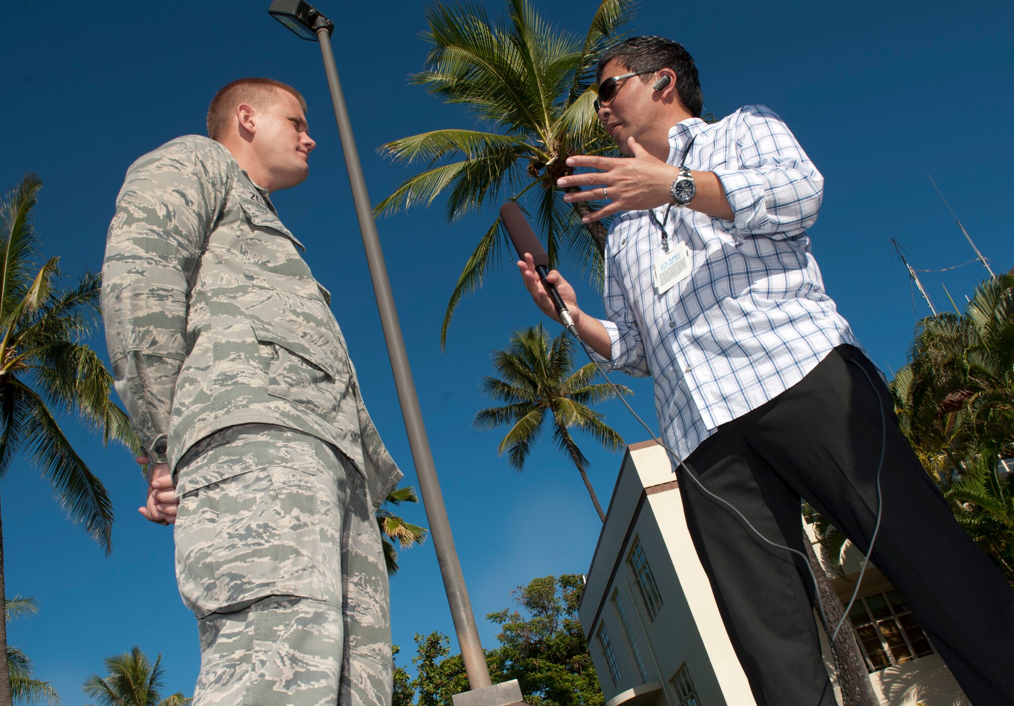 2nd Lt. Michael Zelinski, assigned to the 17th Operational Weather Squadron, speaks to local media about his opportunity to meet President Barack Obama prior to his departure from Joint Base Pearl Harbor-Hickam, Hawaii, on Air Force One, Nov. 15. "It was a tremendous honor to meet the President and shake his hand," said Zelinski. Zelinkski was selected to be apart of the crowd to meet President Obama, in recognition of his dutiful work performance. (U.S. Air Force photo/Senior Airman Lauren Main)