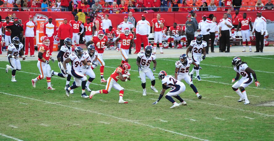 KANSAS CITY, Mo. -- A Kansas City Chiefs running back lowers his shoulders before being tackled by Denver Broncos defenders during an American Football Conference West game at Arrowhead Stadium Nov. 13. The Broncos beat the Chiefs 17-10 to clinch a week-long AFC West lead. (U.S. Air Force photo/Senior Airman Nick Wilson)