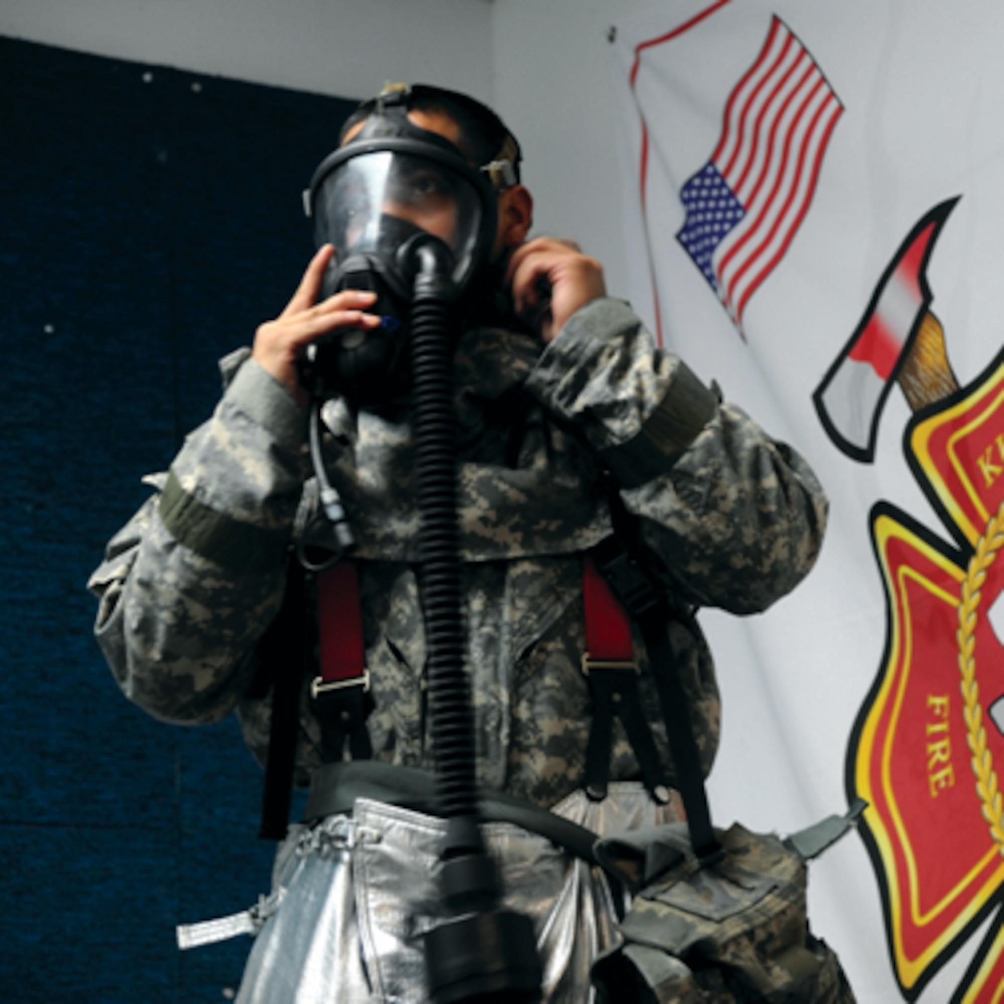 Staff Sgt. Timothy Cruz practices donning and doffing procedures with the new Joint Firefighter's Integrated Response Ensemble at Kunsan Air Base, South Korea. Airmen participated in a final field evaluation of the suit testing the time to put on the JFIRE suits versus the previous version. Cruz is a firefighter assigned to the 8th Civil Engineer Squadron. (Air Force Image)