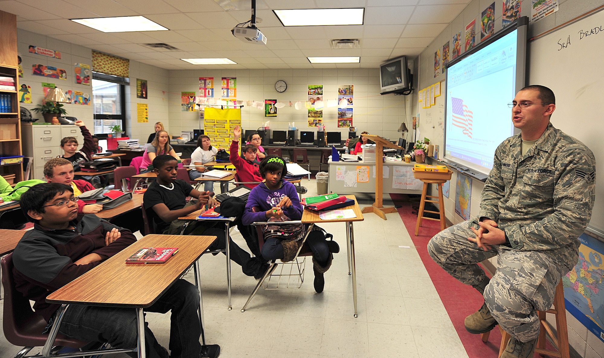 U.S. Air Force Senior Airman Bradley Shimkus, 23rd Logistics Readiness Squadron vehicle operator, answers questions from Lowndes Middle School students Nov. 10, 2011. Students asked questions about the military lifestyle, deployments and how it feels to be a veteran serving the country. (U.S. Air Force photo by Staff Sgt. Stephanie Mancha/Released)
