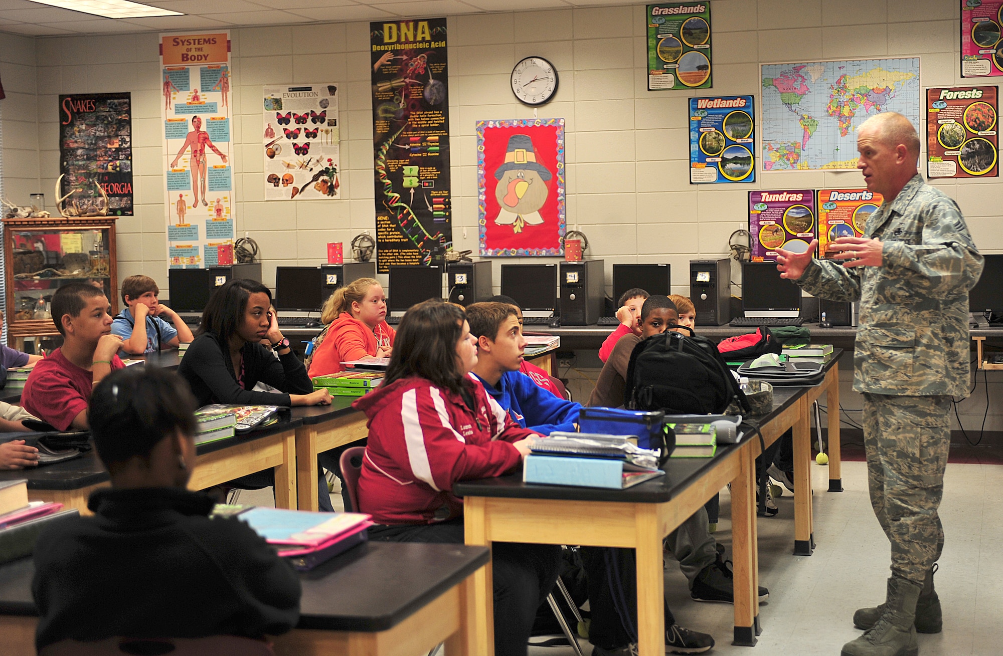 U.S. Air Force Chief Master Sgt. Frank Batten, 23rd Wing command chief, speaks to a seventh-grade class from Lowndes Middle School about the military and his career in the Air Force Nov. 10, 2011. Every year, Moody Airmen are invited to speak at Lowndes in recognition of Veterans Day. (U.S. Air Force photo by Staff Sgt. Stephanie Mancha/Released)
