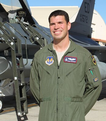 Capt. Joe Peterson, flight test engineer, 416th Flight Test Squadron stands in front of an F-16 at Edwards Air Force Base, Nov. 14. Capt. Peterson was selected "Warrior of the Week" for Team Edwards Nov. 14-18. (U.S. Air Force Photo by Meredith Mingledorff)