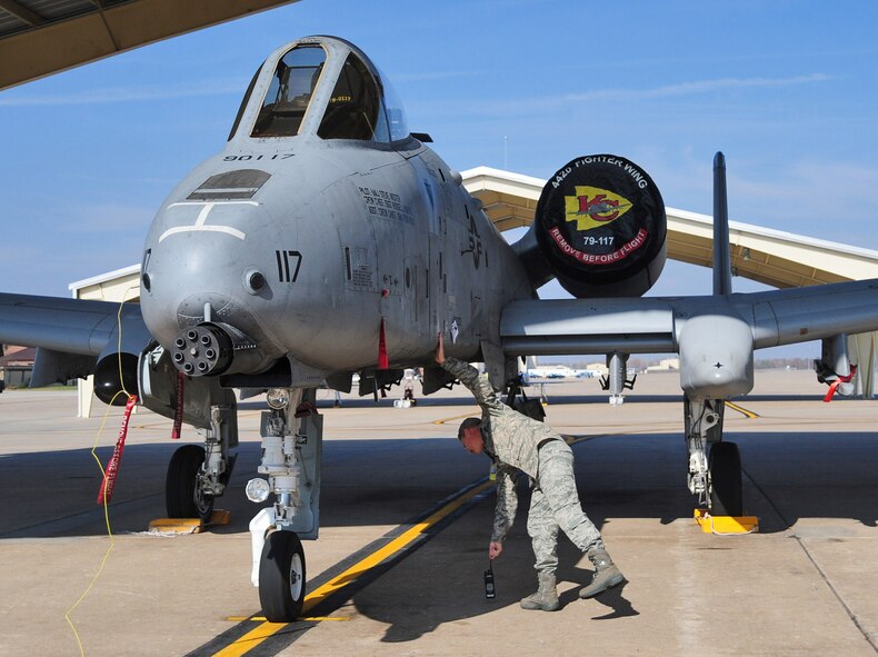 WHITEMAN AIR FORCE BASE, Mo. -- Chief Master Sgt. Mike Pignotti, 442nd Maintenance Squadron propulsion supervisor, closes one of the panels on an A-10 Thunderbolt II after a phase inspection here Nov. 3. Each A-10 is required to undergo a phase inspection every 500 hours. (U.S. Air Force photo/Senior Airman Nick Wilson)