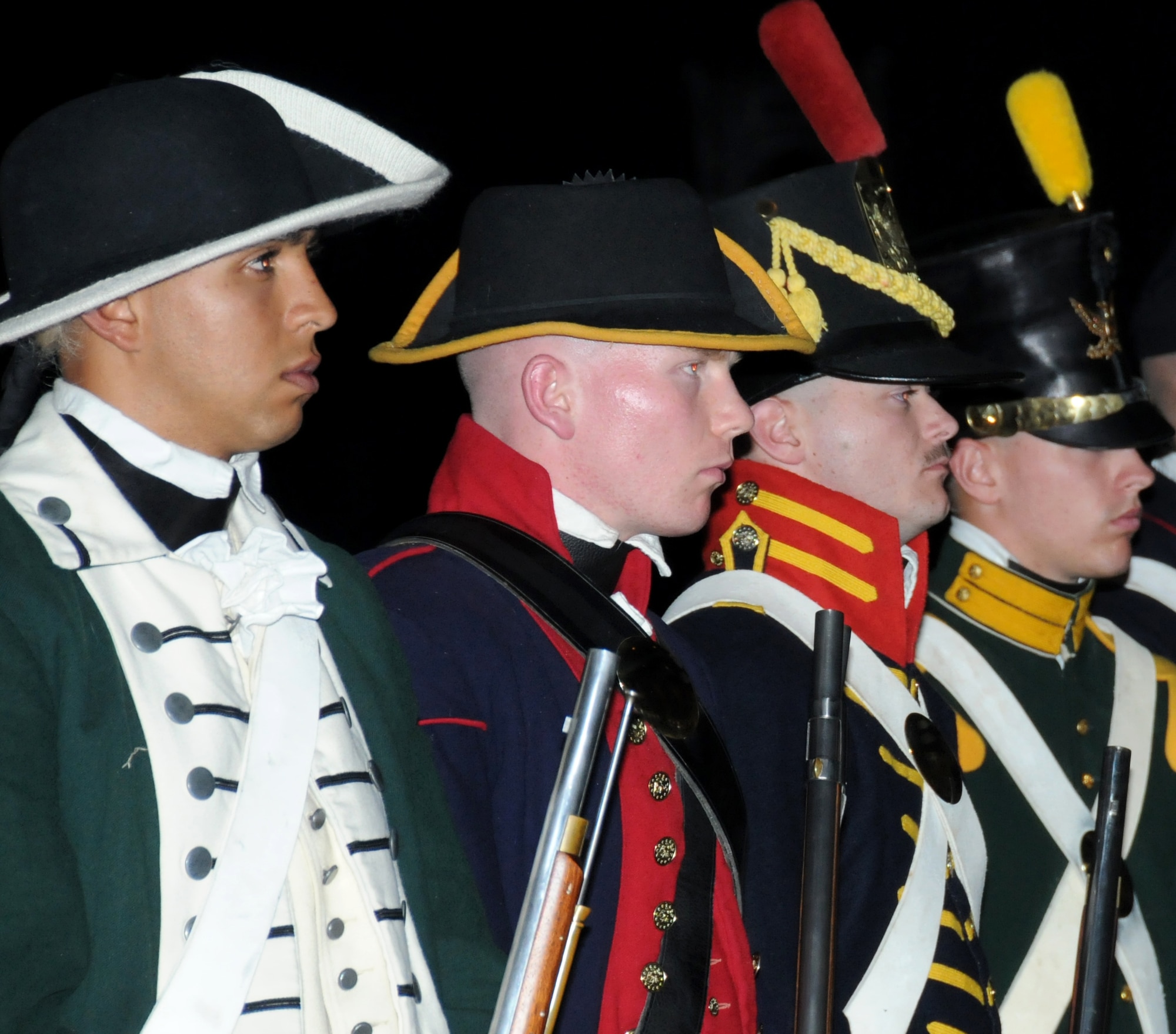 Lance Cpl. Cesar Reynaga, PFC. Jack Gladish, PFC. Virgil Enos, and Lance Cpl. William Fifer participate in the historical uniform pageant which showcases the uniforms of the Marine Corps over the past 236 years, during the Marine Corps Ball Nov. 10, 2011, at the Mississippi Coast Coliseum Convention Center in Biloxi, Miss.  (U.S. Air Force photo by Kemberly Groue)