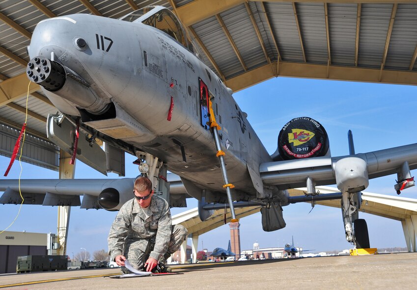 WHITEMAN AIR FORCE BASE, Mo. -- Senior Airman Jeremy Fly, 442nd Aircraft Maintenance Squadron weapons loader, updates aircraft forms after a gun is loaded onto an A-10 Thunderbolt II here Nov. 4. These forms are updated every three to four days. (U.S. Air Force photo/Senior Airman Nick Wilson)