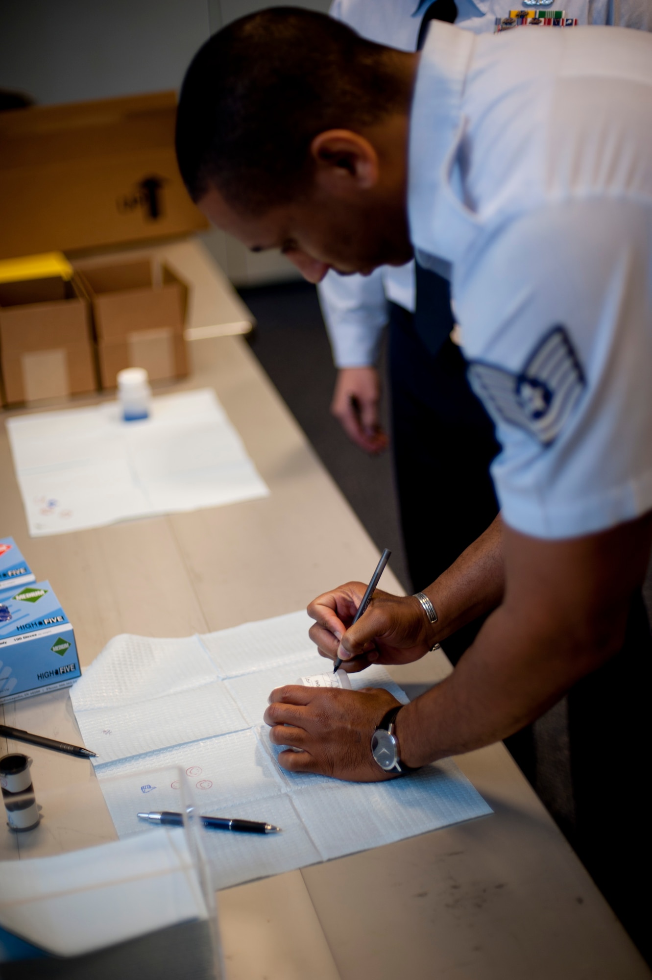 Tech. Sgt. Kenneth Lasker, 22nd Contracting Squadron Simplify Acquisitions NCOIC, underwent a urinalysis test during Operation Night Hawk Nov. 14, 2011, McConnell Air Force Base, Kan. ONH is set up by the Drug Demand Reduction Program throughout the base at random times and places, testing any active duty Airmen that pass by. ONHs are one of the tools available to commanders to promote good order and discipline.(U.S. Air Force photos/ Airman 1st Class Armando A. Schwier-Morales)