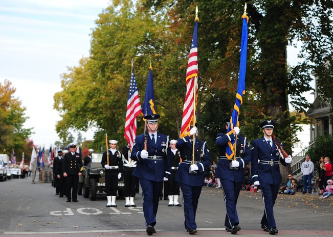 Beale Air Force Base Honor Guard displays the colors and leads the Veterans Day Parade in Marysville, Calif., November 11, 2011. Thousands of local community members attended the parade in honor of the holiday. (U.S. Air Force photo by Airman 1st Class Shawn Nickel)