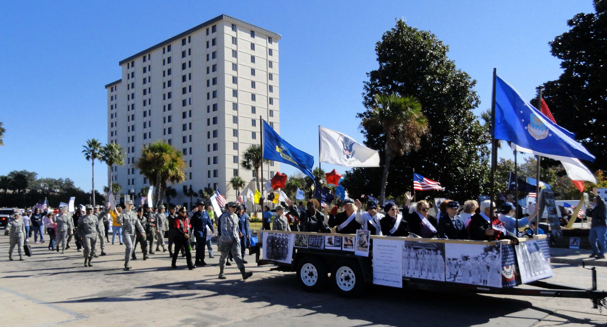 A formation of current and former female servicemembers -- many from 1st Air Force (Air Forces Northern) -- marches during the Panama City Veterans Day parade Nov. 11, 2011. Other parade participants included the Patriot Riders and ROTC units from various area schools. Brig. Gen. Robert Beletic, 1st Air Force (Air Forces Northern) vice commander, was the guest speaker for the parade. (U.S. Air Force photo by Mary McHale) 