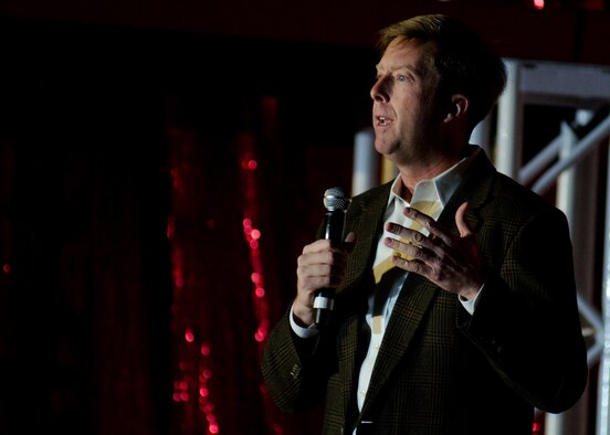 Col. R. Wyn Elder, 62nd Airlift Wing commander, speaks to the audience at McChord Field before the Tops in Blue show Nov. 8, 2011, at Joint Base Lewis-McChord, Wash. With approximately 20 Tops in Blue shows under his belt, the co-host for the event said this year's show was the best he'd seen yet. (U.S. Air Force photo/David Poe)