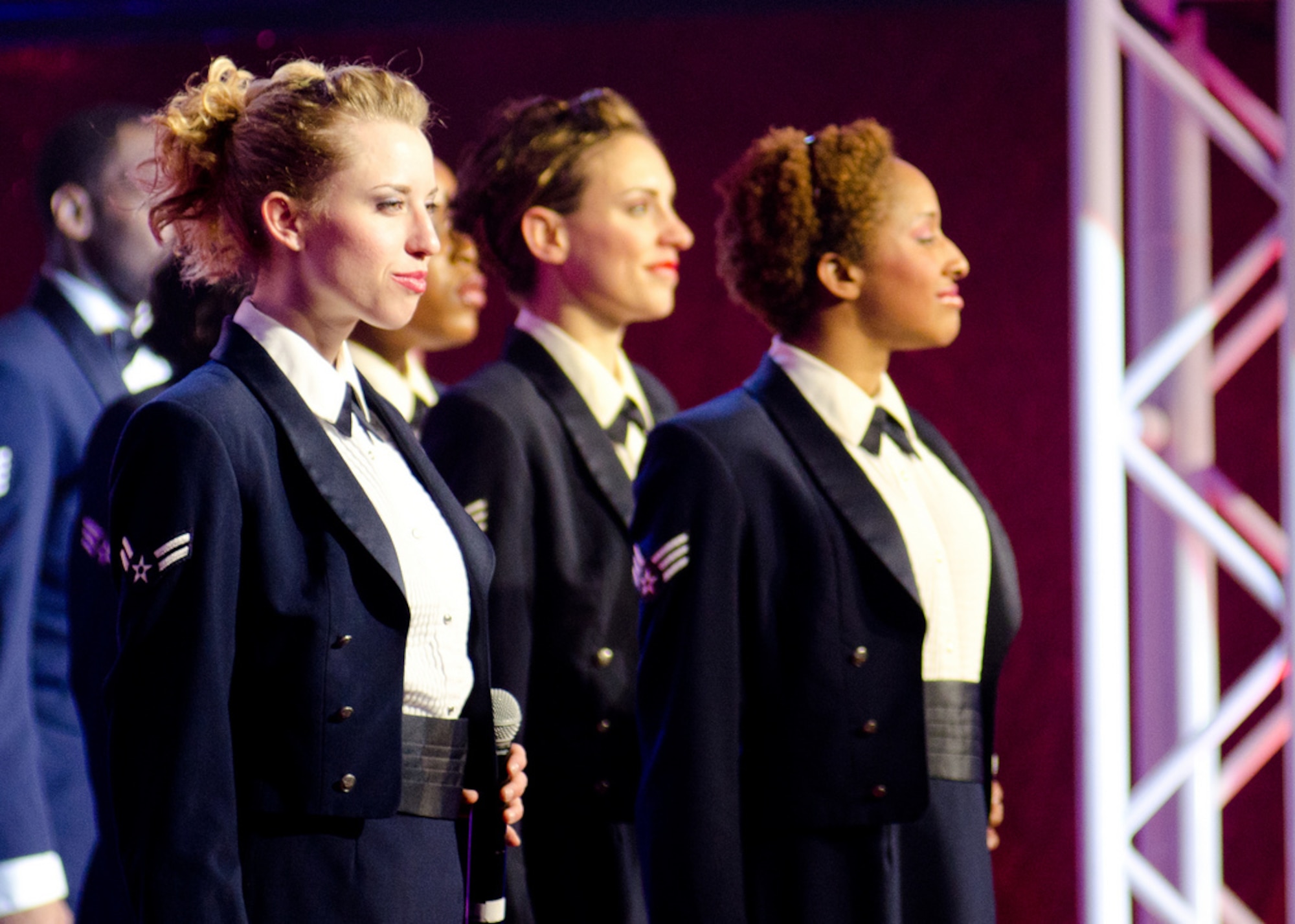 Airman 1st Class Kristen Walsh, left, and the Airmen of Tops in Blue perform Nov. 8, 2011, at Joint Base Lewis-McChord, Wash. Tops in Blue is an Air Force special unit which showcases the talent of some of the service's best Airmen. (U.S. Air Force photo/David Poe)