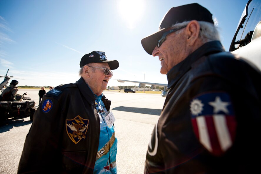 Kirk Kirkpatrick, left, and James Taylor, World War II era 75th Fighter Squadron pilots, share laughs during the 2011 Flying Tigers Reunion at MacDill Air Force Base, Fla., Nov. 11, 2011. The two are original Flying Tigers who defended China during WWII. They used the reunion to catch up with friends from the past and meet with current pilots of the 23rd Fighter Group as they honored 70 years of Flying Tiger history. (U.S. Air Force photo by Staff Sgt. Jamal D. Sutter/Released) 