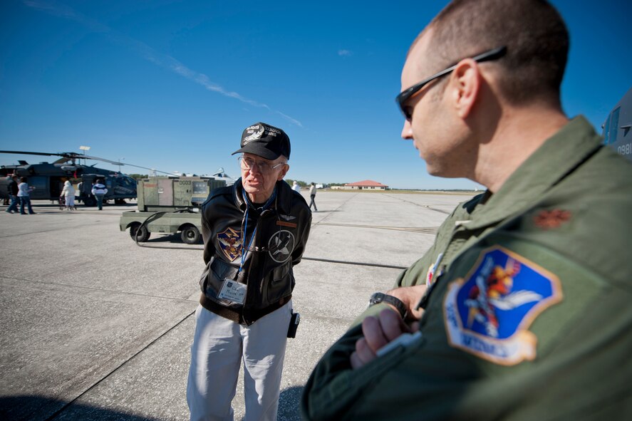Don Miller, former 75th Fighter Squadron pilot, speaks with U.S. Air Force Maj. Sean Hosey, 71st Rescue Squadron, during the 2011 Flying Tigers Reunion at MacDill Air Force Base, Fla., Nov. 11, 2011. Hosey showcased and answered questions about an HC-130P Combat King during a static display. (U.S. Air Force photo by Staff Sgt. Jamal D. Sutter/Released) 