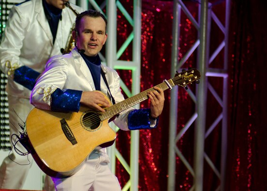 Senior Airman James Santos performs as a member of Tops in Blue Nov. 8, 2011, at Joint Base Lewis-McChord, Wash. Santos, who's stationed here as a member of the 62nd Maintenance Squadron, is currently travelling as a band member with Tops in Blue, the Air Force's premier entertainment showcase, on their tour of installations worldwide. (U.S. Air Force photo/David Poe)