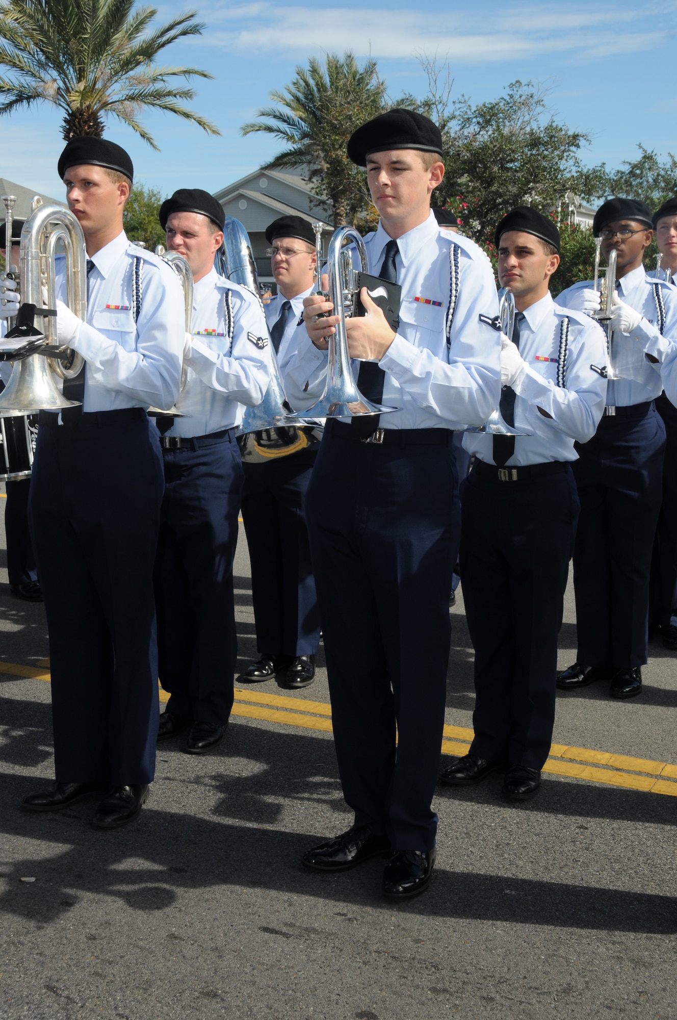 Members of the Drum and Bugle Corp from Keesler Air Force Base, Miss., participate in the 11th Annual Gulf Coast Veterans Day Parade in D’Iberville, Miss., Nov. 12, 2011.  The Drum and Bugle Corp played the National Anthem during the parade.  (U.S. Air Force photo by Kemberly Groue)