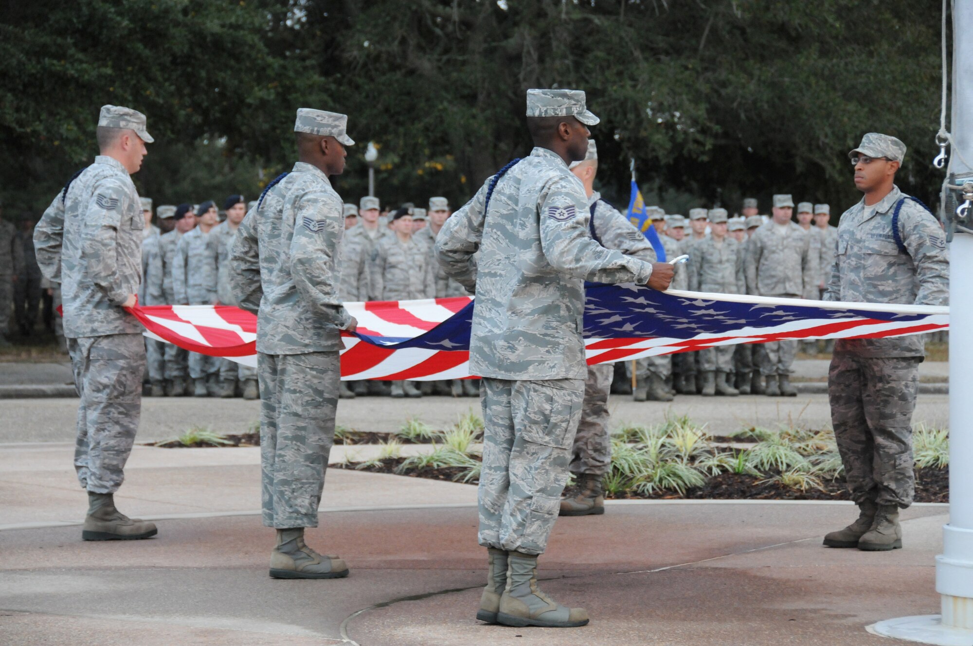 81st Training Group Military Training Leaders conduct a flag folding ceremony during a retreat ceremony in front of the wing headquarters’ building at Keesler Air Force Base Nov. 9, 2011. Various members of the 81st Training Wing were in attendance. (U.S. Air Force photo by Kemberly Groue) 
