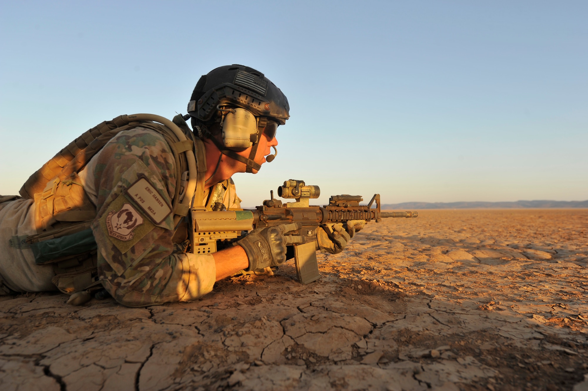 First Lt. Eric Hansen, an 82nd Expeditionary Rescue Squadron combat rescue officer, provides security during a training scenario in the Grand Bara Desert, Djibouti, Oct. 21, 2011. The 360-degree security allows pararescuemen to concentrate their efforts on providing treatment to casualties and coordinating air evacuation support. (U.S. Air Force photo/Staff Sgt. Renae Saylock)
