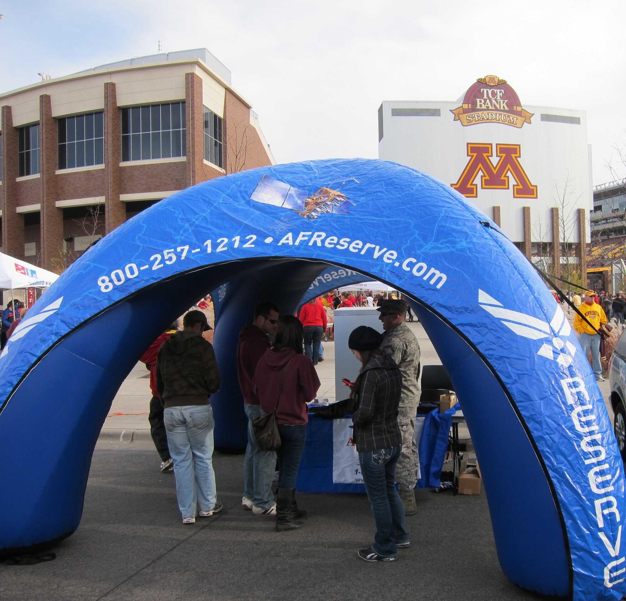 934th Airlift Wing recruiters take advantage of the Gophers vs. Badgers college football came talking with potential recruits from Minnesota and Wisconsin before the game Nov. 12. (Air Force Photo/Paul Zadach)