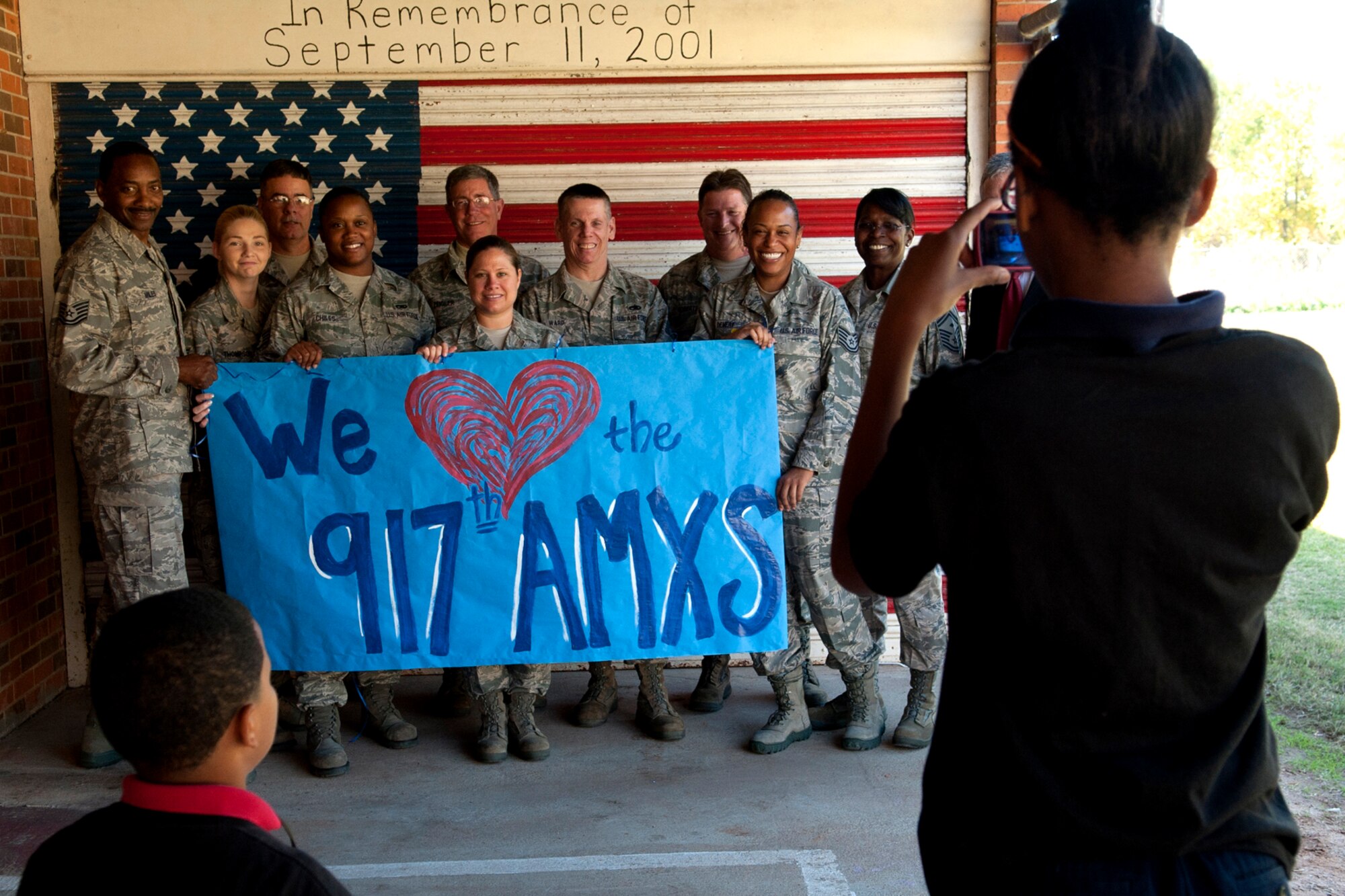 Members of the 917th Fighter Group gather for a group photo at the Phoenix Magnet Elementary School, Alexandria, La., Nov. 10, 2011. The school hosted a group of 917th Fighter Group personnel, who visited all 675 students, answering questions about themselves, their jobs and the Air Force Reserve. (U.S. Air Force photo by Master Sgt. Greg Steele/Released)