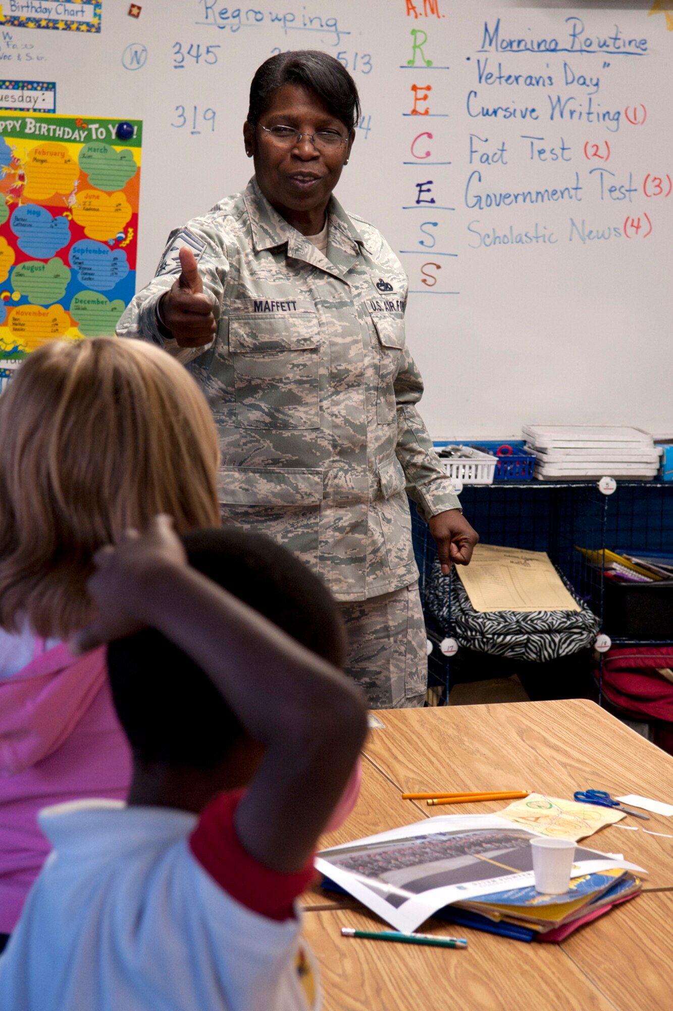 U.S. Air Force Senior Master Sgt. Margaret Maffett, 917th Aircraft Maintenance Squadron first sergeant and teacher at the Phoenix Magnet Elementary School, talks with her students on Nov. 10, 2011. The school hosted a group of 917th Fighter Group personnel, who visited all 675 students, answering questions about themselves, their jobs and the Air Force Reserve. (U.S. Air Force photo by Master Sgt. Greg Steele/Released)