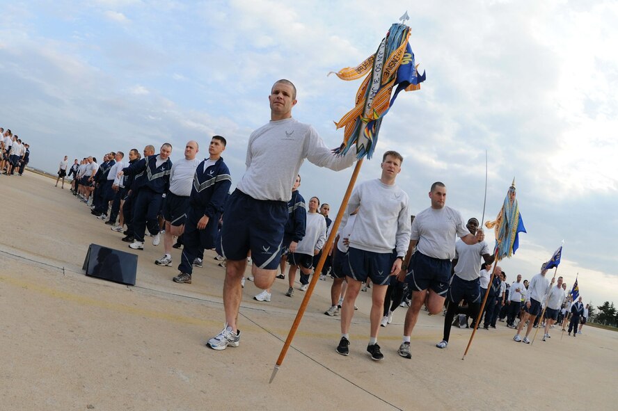 Members of the Wolf Pack perform stretches after participating in a warrior run at Kunsan Air Base, Republic of Korea, Nov. 10. The warrior run is a formation run and a way to boost the morale of Airmen and Soldiers. (U.S. Air Force photo by Senior Airman Brittany Y. Auld/Released)